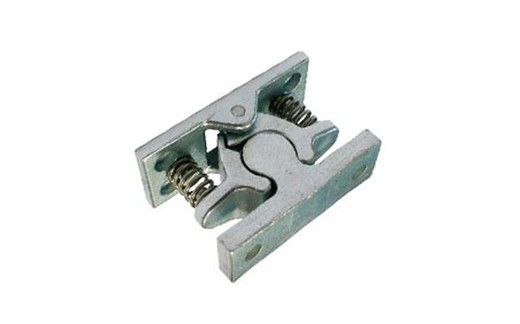 Refrigerator door retainer with spring